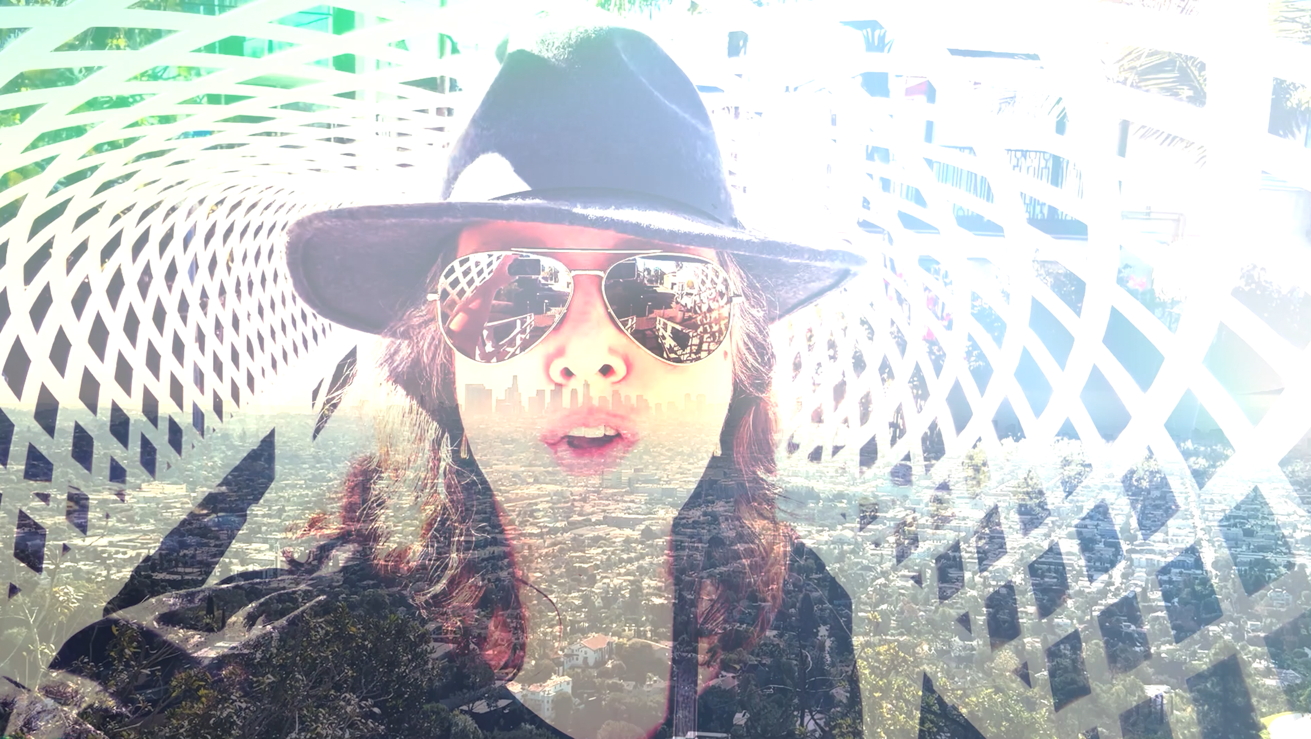 A montage from the Don't Get Too Close To The Fire Burn Burn Burn music video with an overlay of Anne-Lise standing on a Venice Canal bridge with the city of Los Angeles in the background.